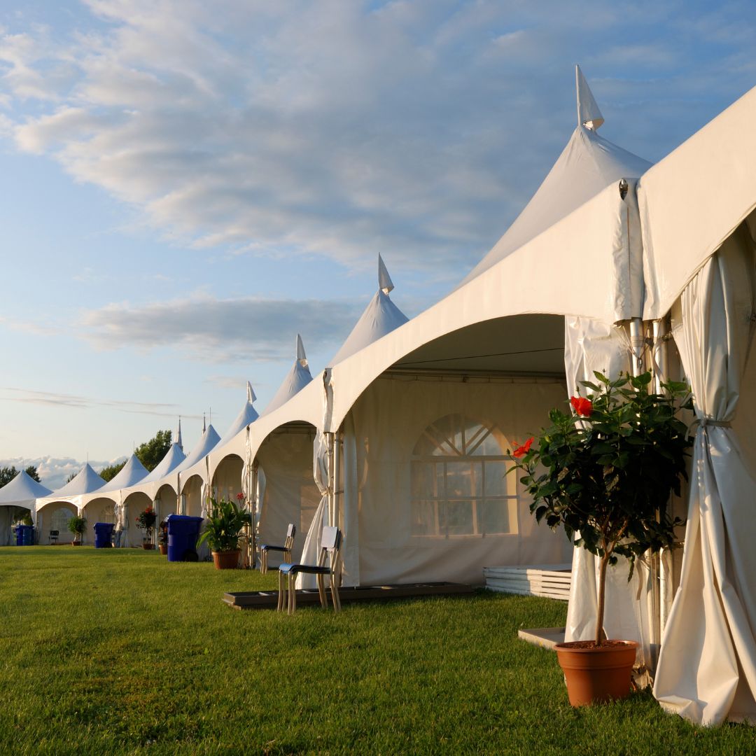 a row of outdoor tents set up