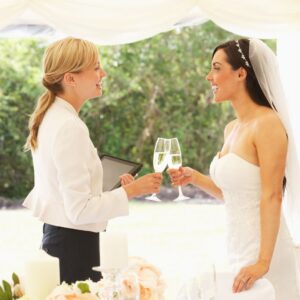 bride and coordinator cheersing