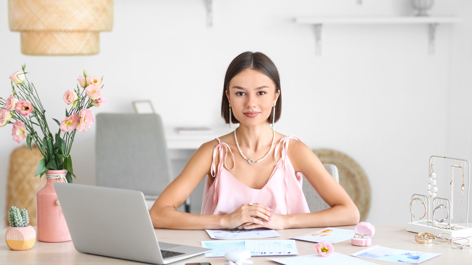 Wedding coordinator sits at a desk